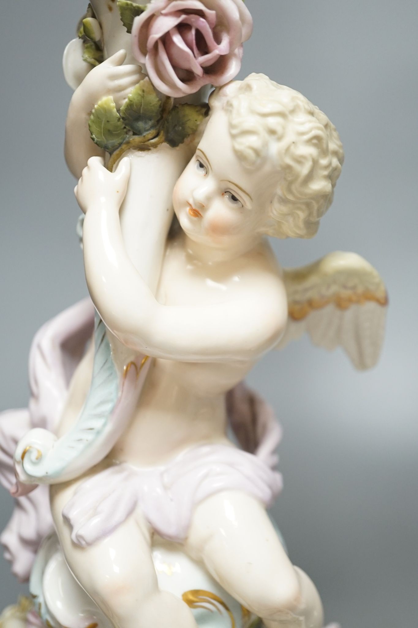 A pair of Sitzendorf 'cherub' candelabra 50cm